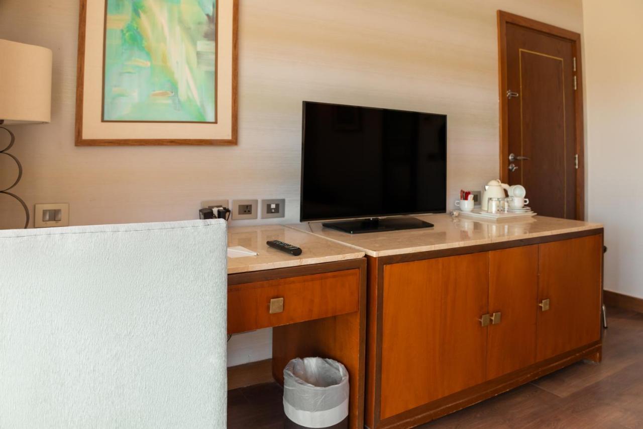 Hotel Sharm Dreams Vacation Club - Aqua Park Exteriér fotografie A television in a hotel room